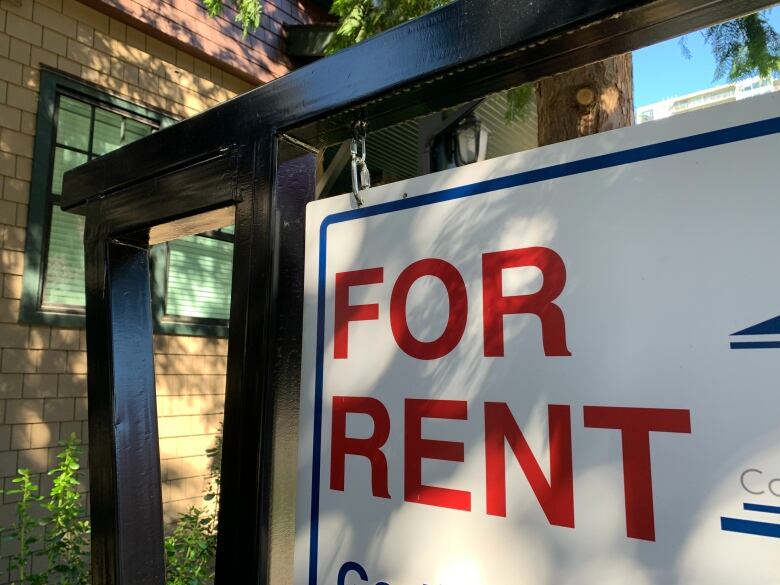 a close up of a for rent sign 