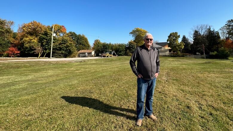 man stands in field