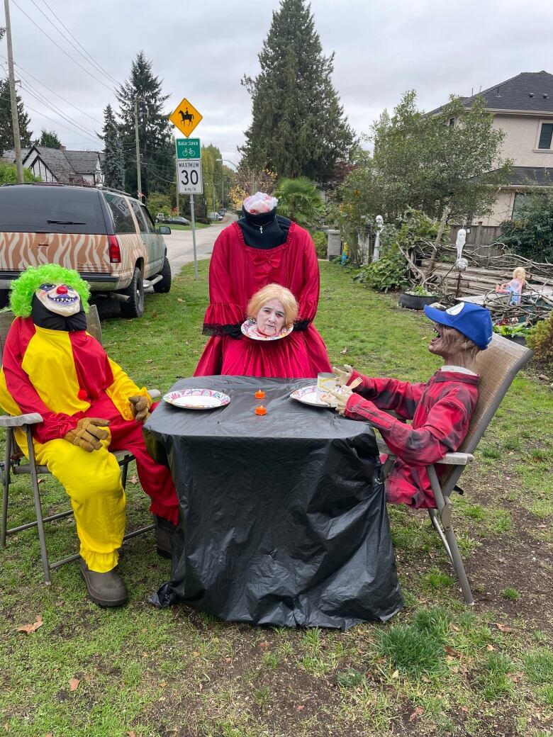 A costume of a woman pretending to be a cut-out head served to fake murderous clowns.