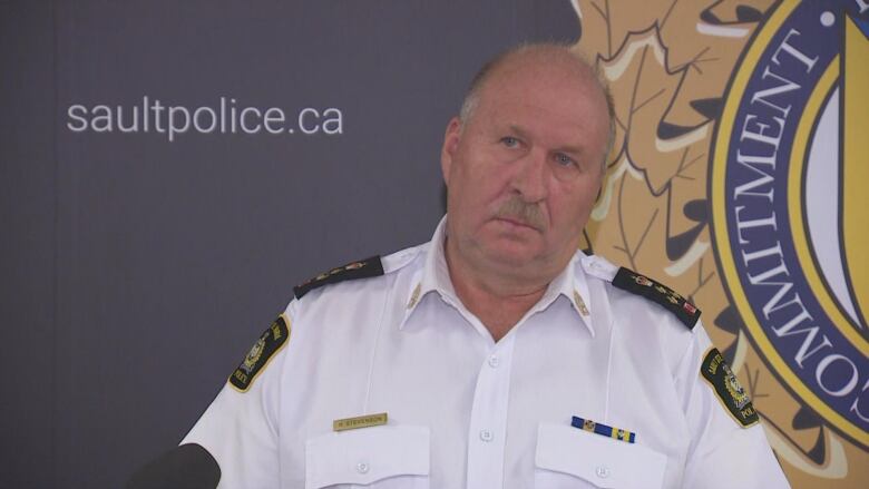 A police officer in a white uniform.