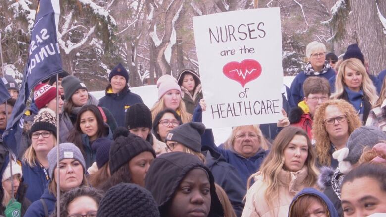 Nurses, nursing students and members of the public rallying in Wascana Park.