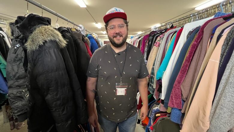 A man in a shirt and lanyard 