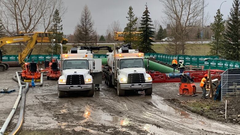 Crews respond at the site of a pipeline break near the Bow River in Cochrane last weekend. 