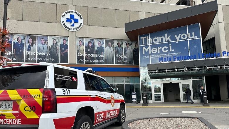 A fire services vehicle parked outside of the Ottawa Hospital's main doors. 