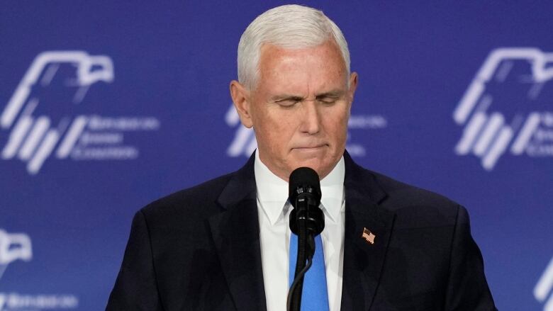 Former U.S. vice president Mike Pence, standing at a podium, at a Republican Jewish Coalition event in Las Vegas.