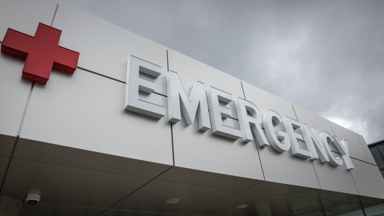 An emergency sign on a building is shown.