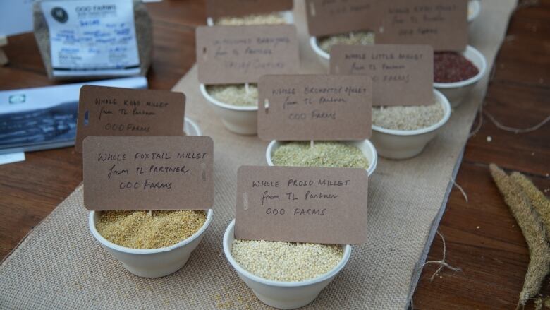 Bowls of millet varieties from local farmers sit on display on a table in Mumbai, India 