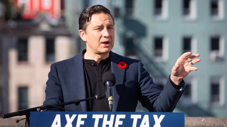 Conservative Leader Pierre Poilievre holds a press conference regarding his Axe the Tax message from the roof a parking garage in St. Johns.