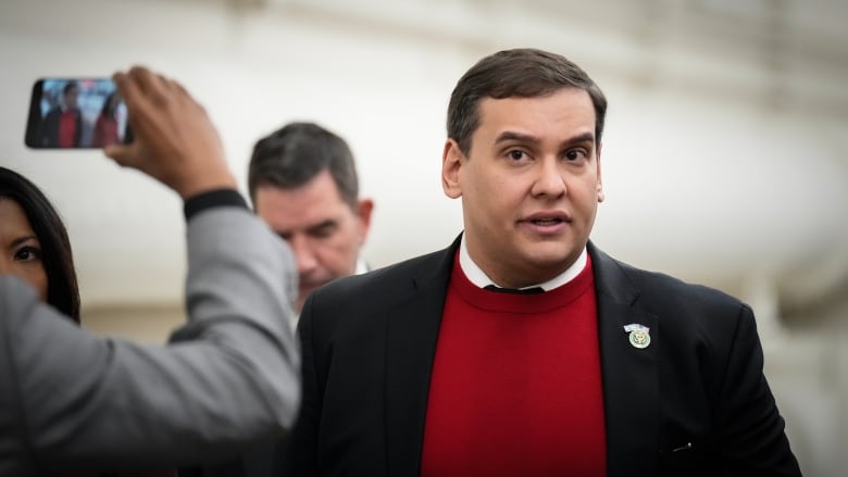 Republican George Santos walking back to his office after a House floor debate on a resolution to expel him from the U.S. Congress.