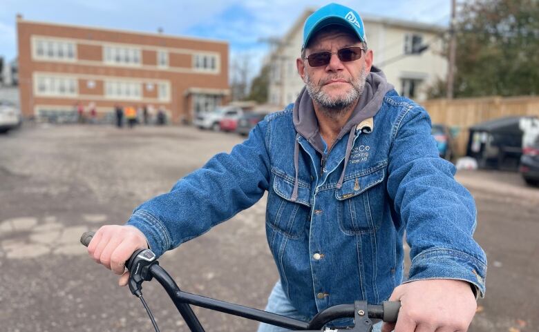 A man riding a bicycle.