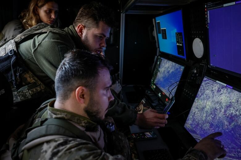 Ukrainian soldiers review video being received from a 'Shark' drone in Ukraine's Kharkiv region.