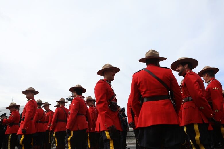 RCMP officers gather before the start of the B.C. Law Enforcement Memorial march towards a ceremony at the legislature in Victoria, B.C., on Sunday, September 24, 2023. 