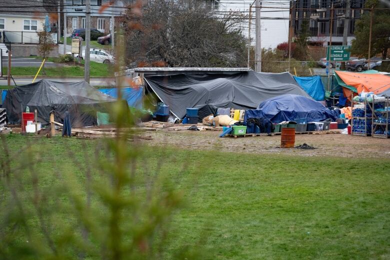 A field with tents is shown