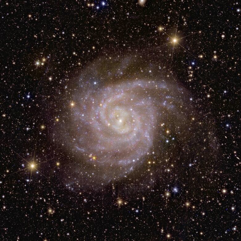 An image shows a spiral galaxy.