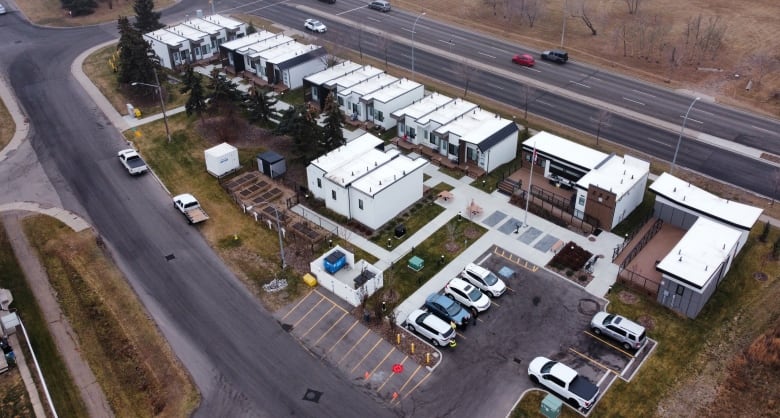 Drone footage of tiny homes from above on a foggy day. 