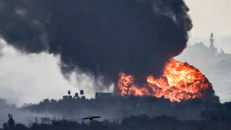 A fireball is seen erupting in the Gaza Strip on Wednesday, during Israeli bombardment within the territory.