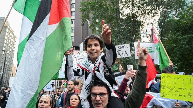 People take part in a protest in support of Palestinians in Montreal, Friday, October 13, 2023.