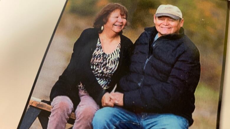 A photo of Joyce and Earl Burns sitting beside each other