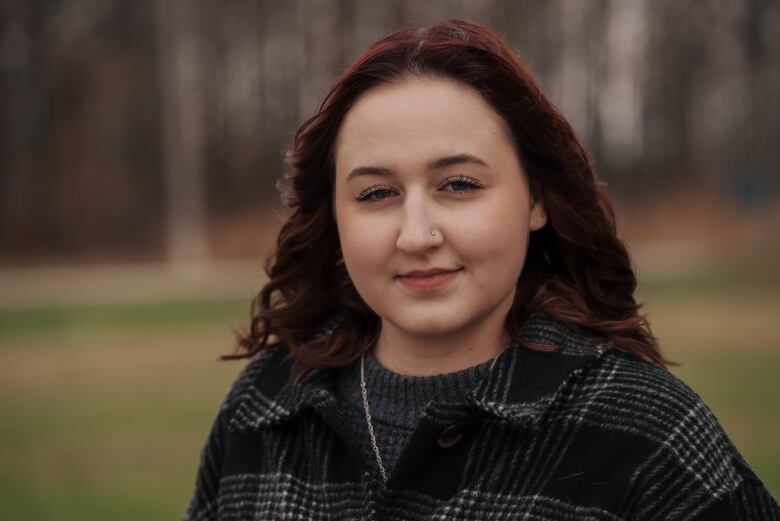 Woman standing in a park.