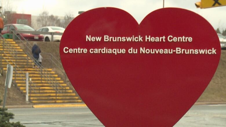 Big heart shaped sign outside hospital.