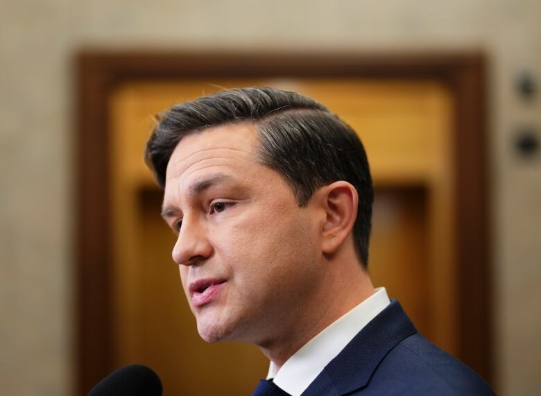 Conservative Leader Pierre Poilievre speaks to reporters in the foyer of the House of Commons on Parliament Hill in Ottawa on Monday, Nov. 6, 2023. 