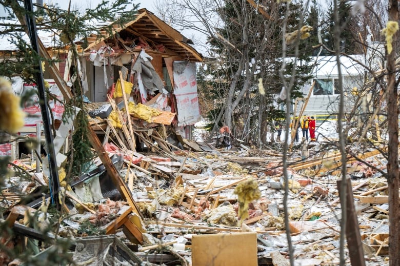 The remnants of a house that was destroyed in an explosion in the Riverdale subdivision of Whitehorse, Yukon is shown on Tuesday, Nov. 14, 2023. An explosion that demolished a home in Whitehorse has killed one person and seriously injured another. 