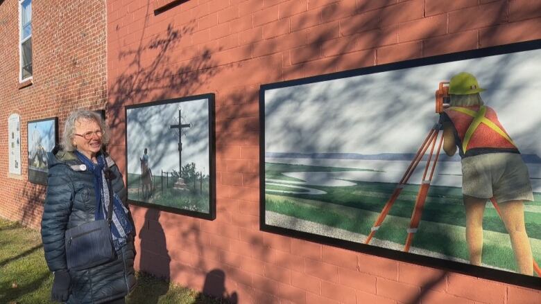 A town councillor is shown at the Alex Colville display