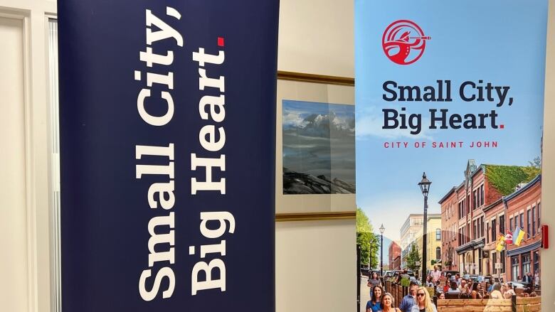 Two slogan banners in Saint John city hall