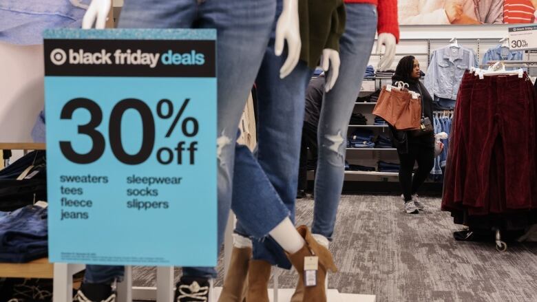 A shopper browses the aisles for bargains on Black Friday