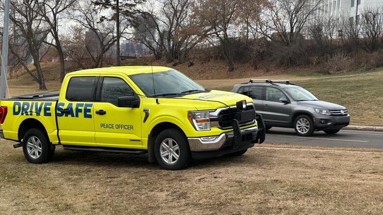 neon yellow pick up truck parked on grass