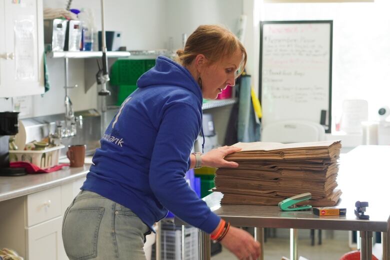 Julie Rose, manager of the Cranbrook Food Bank, is pictured working on holiday preparations on Thursday, Nov. 22, 2023. 