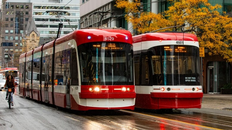 Two TTC streetcars on King Street on November 8, 2023.