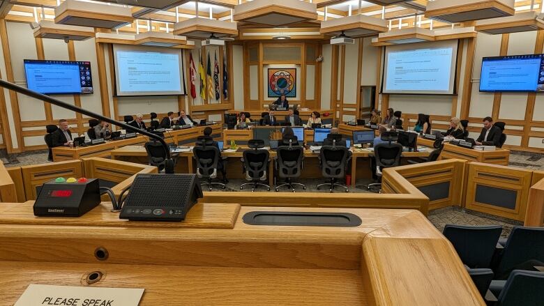 A podium overlooking city council chambers