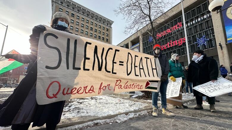 A person holding a banner.