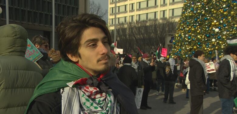 A man talks to the camera. 