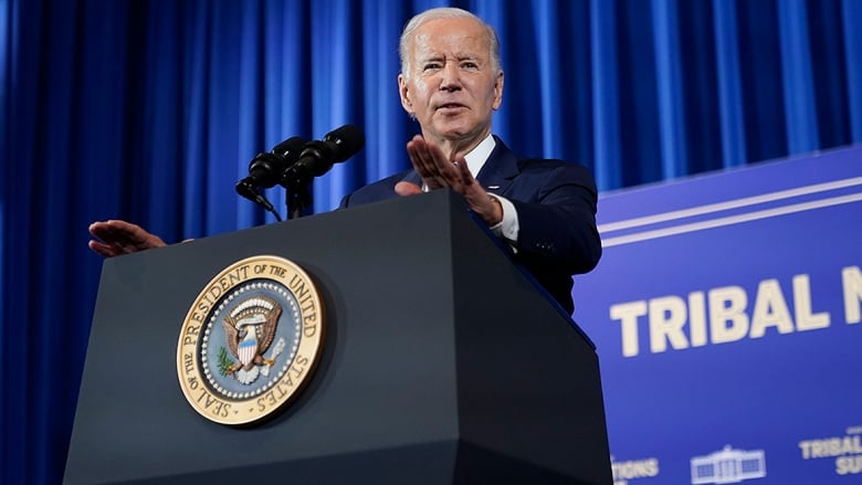 U.S. President stands at podium addressing reporters at the White House Tribal Nations Summit.