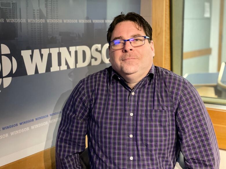 Man looks at camera in the CBC Windsor radio studio.