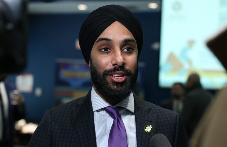 Closeup of bearded man in turban.