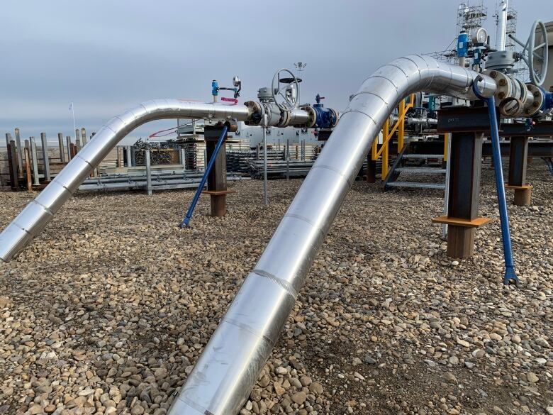 Pipes emerge from the ground at the Steveville helium plant east of Calgary.