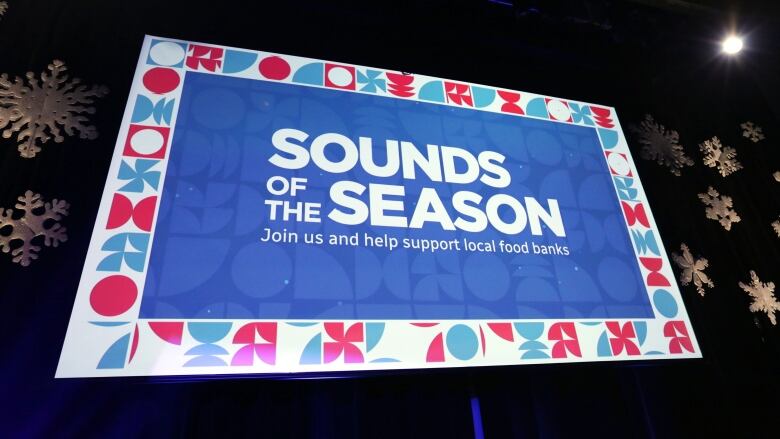 Sounds of the Season 2023 signage on the stage screen in CBC's Glenn Gould Studio.