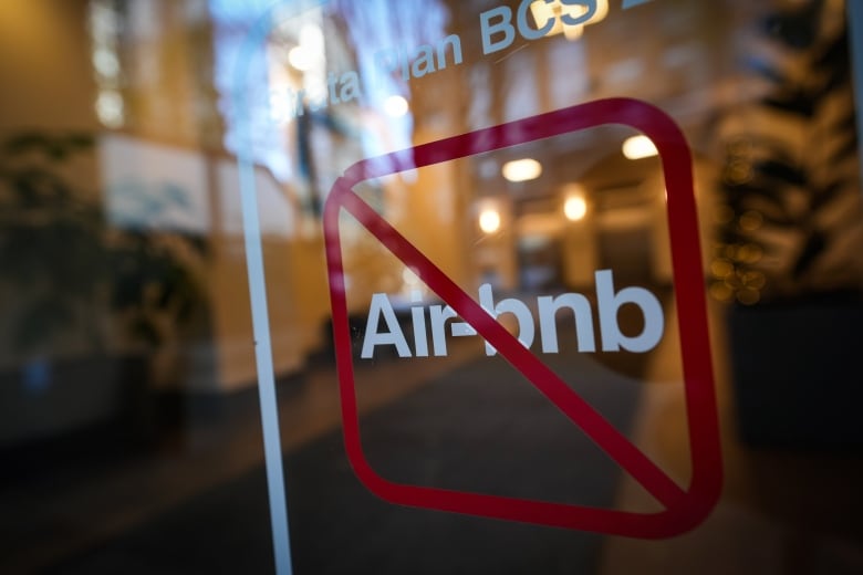 A sign indicating Airbnb rentals are not permitted is seen at the entrance to a condo tower in Vancouver on Thursday, Nov. 23, 2023.