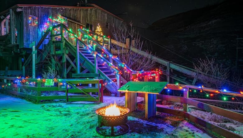 Lights hung on an old wooden building. 