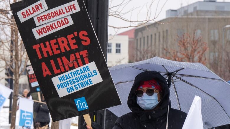 healthcare worker with sign. 