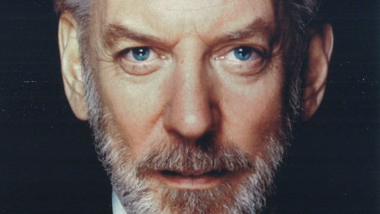 Head shot of actor Donald Sutherland wearing a suit.