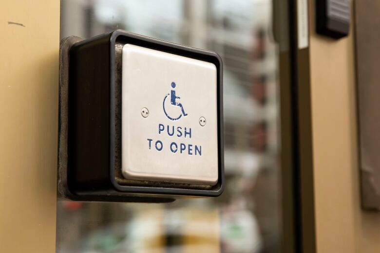 A button people who use wheelchairs can push to open doors.