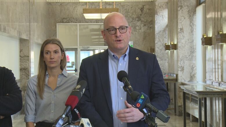 Windsor Mayor Drew Dilkens and Jessica Tsirimbis with RJM Holdings (left) at the Paul Martin Building Conference in downtown Windsor on Thursday, December 14, 2023.