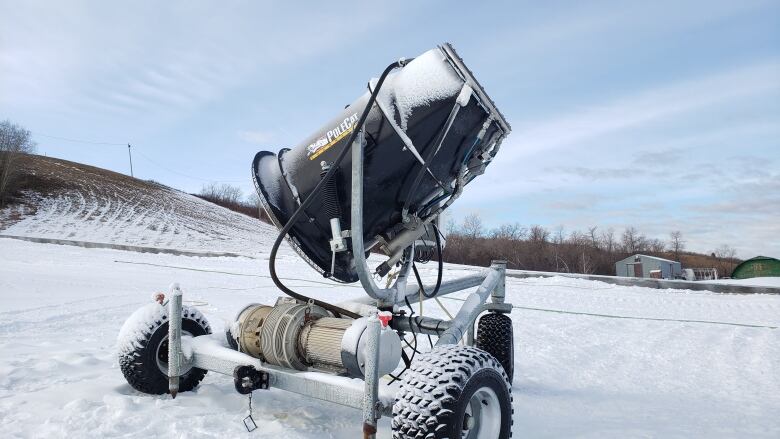 A snow gun sits in a bank of snow at Mission Ridge Winter Park.