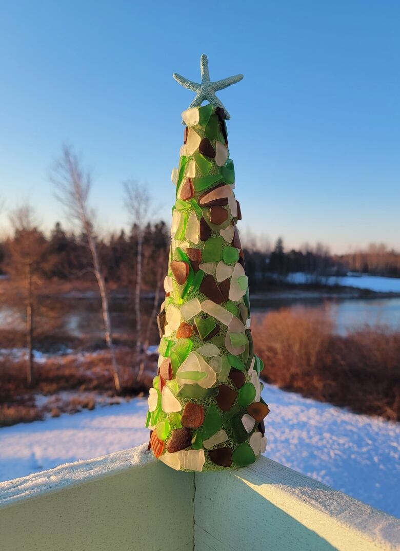 a collection of sea glass in the shape of a small tree