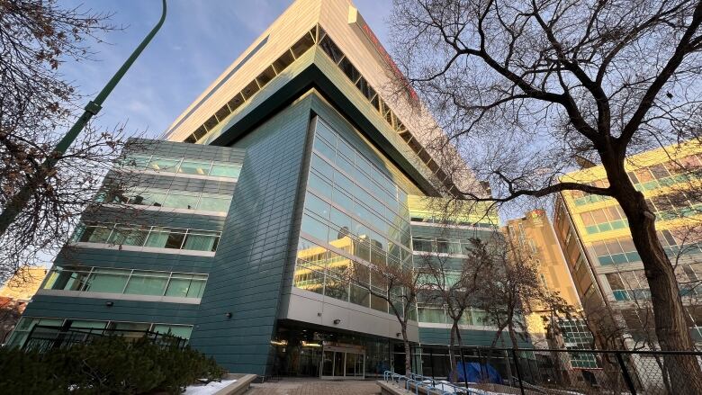 The exterior of a building, comprised of many windows.