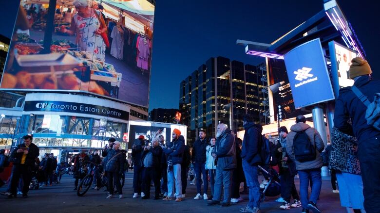 Visitors to Yonge-Dundas Square are pictured on Dec. 14, 2023